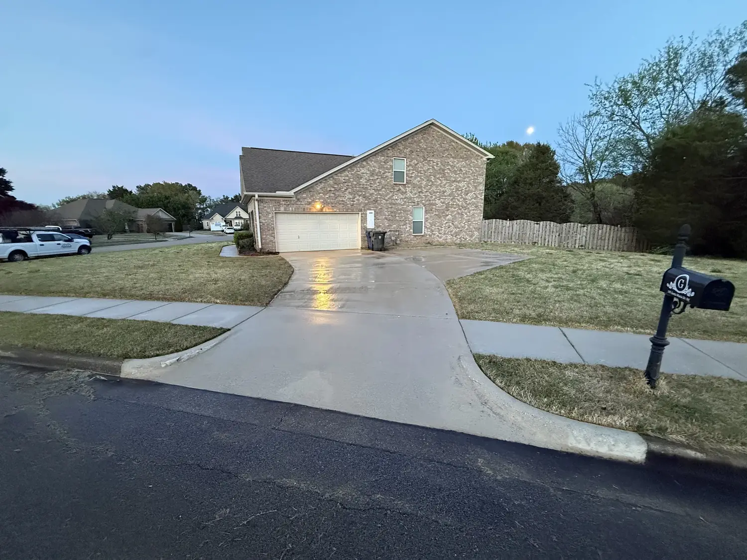 Pressure-washed driveway and sidewalk at a Huntsville home