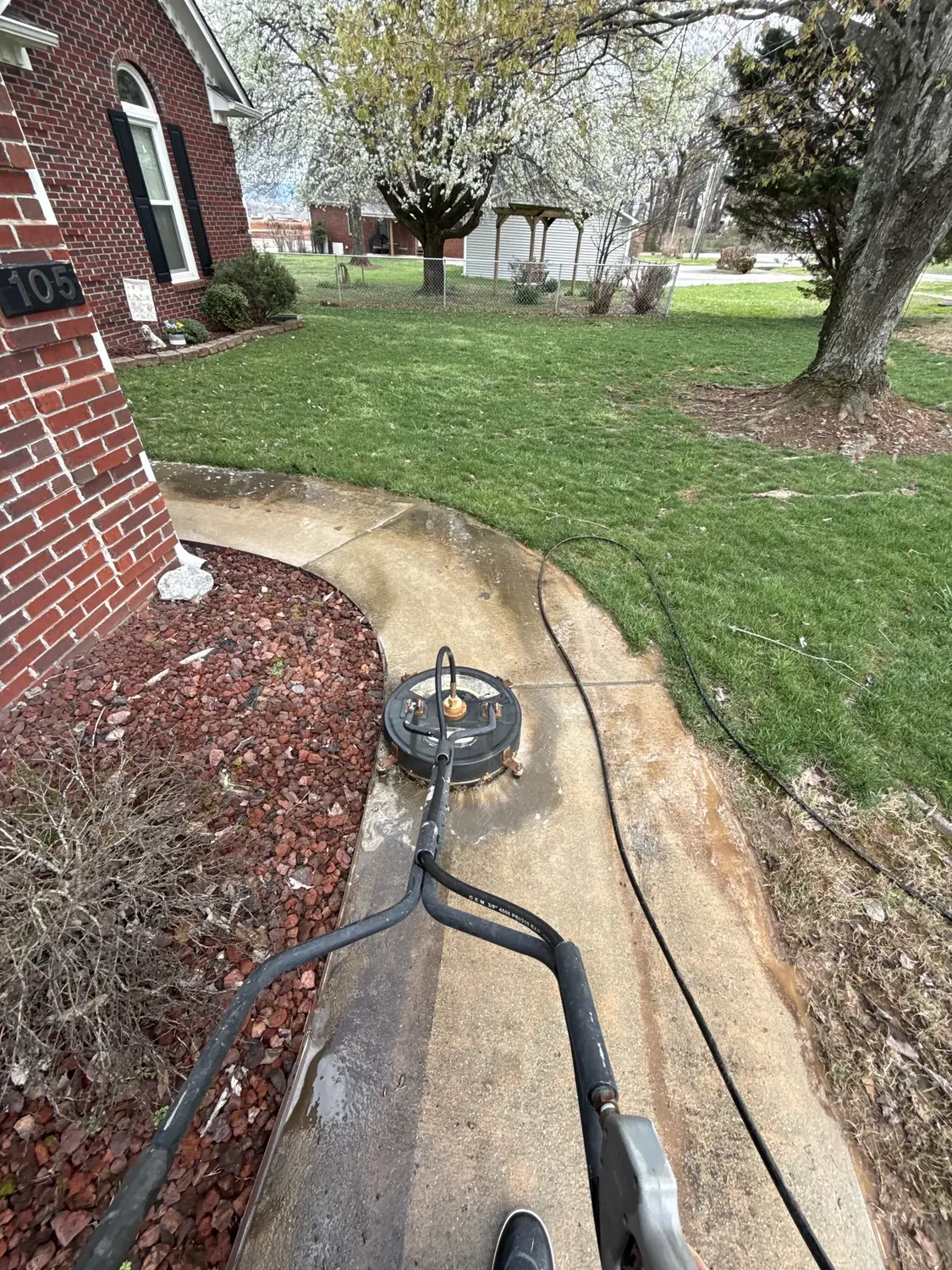 Surface cleaner washing a curved residential walkway
