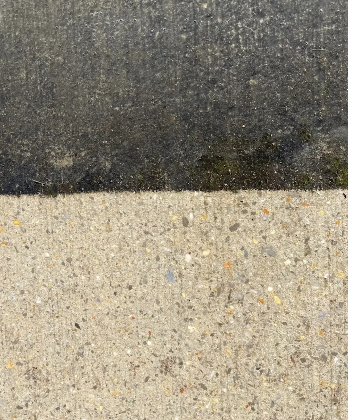 Close-up before and after concrete pressure washing in Huntsville AL