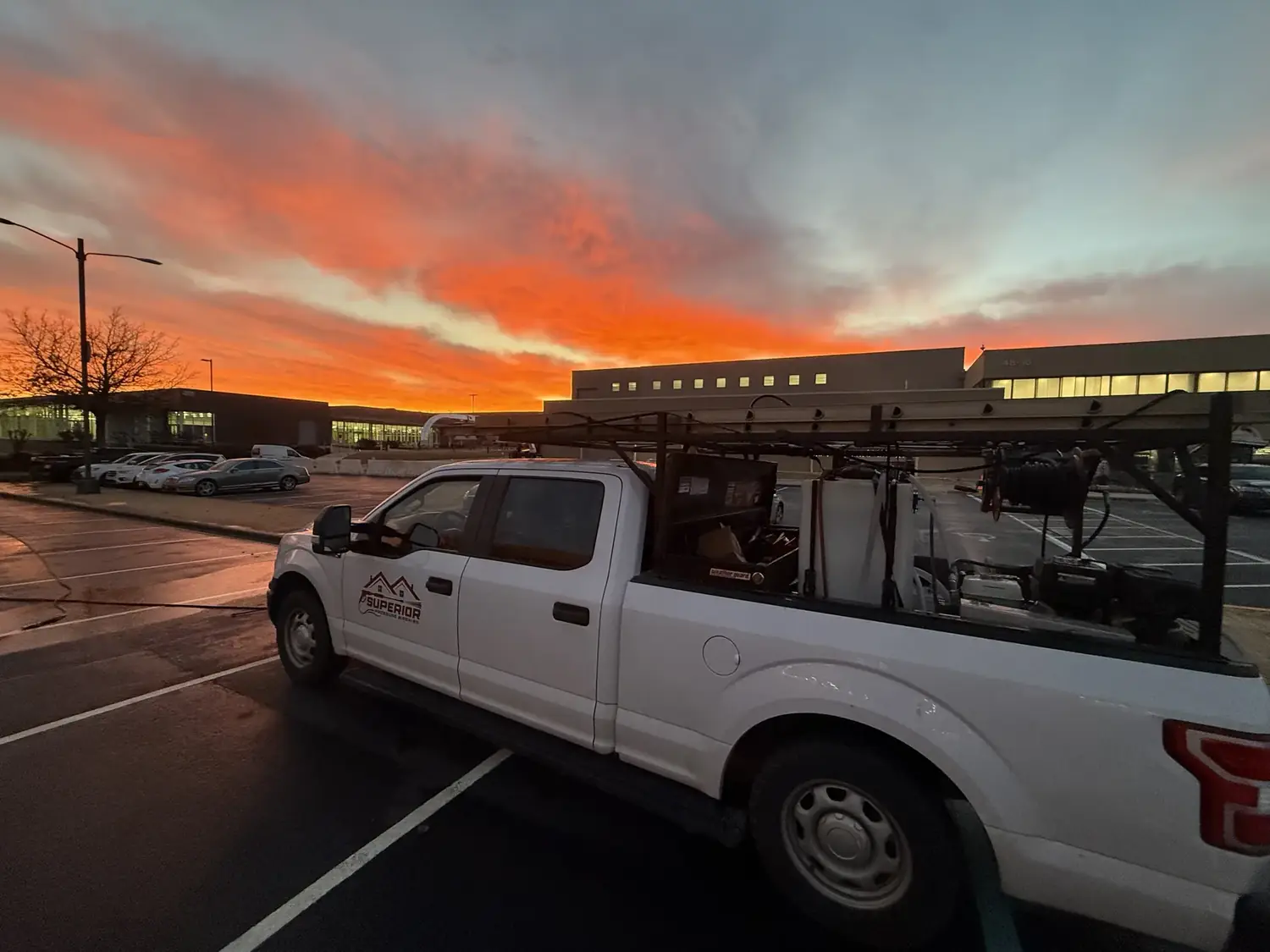 Superior Pressure Washing truck and equipment on site in Huntsville AL at sunset